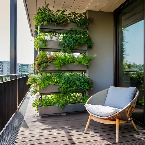 vertical garden on a modern small balcony with hanging planters, wooden wall-mounted pots, and vibrant green plants